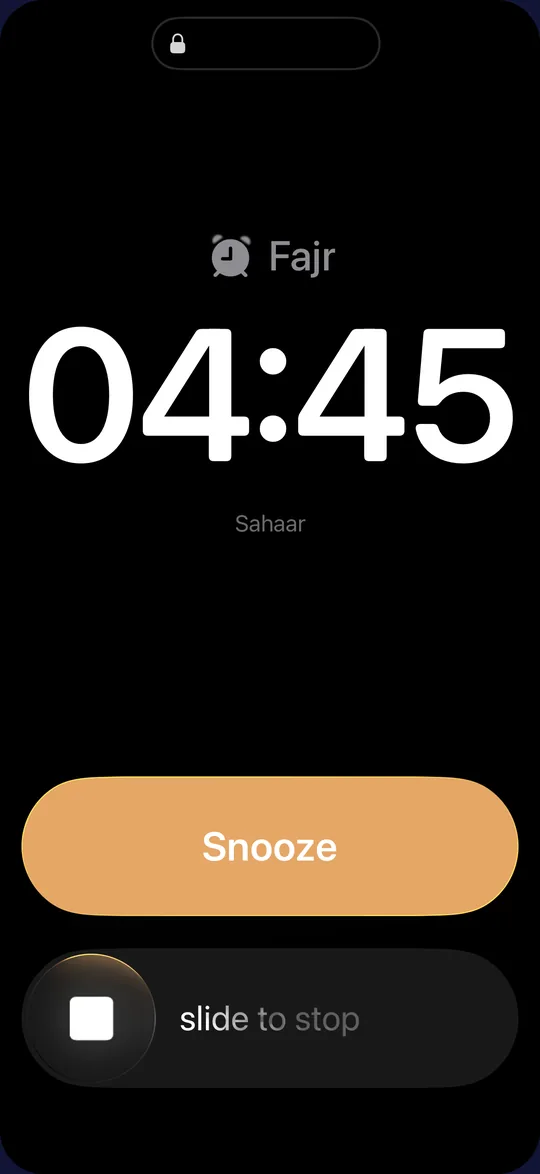 Full-screen iPhone alarm for Fajr at 04:45 with Snooze and slide to stop.